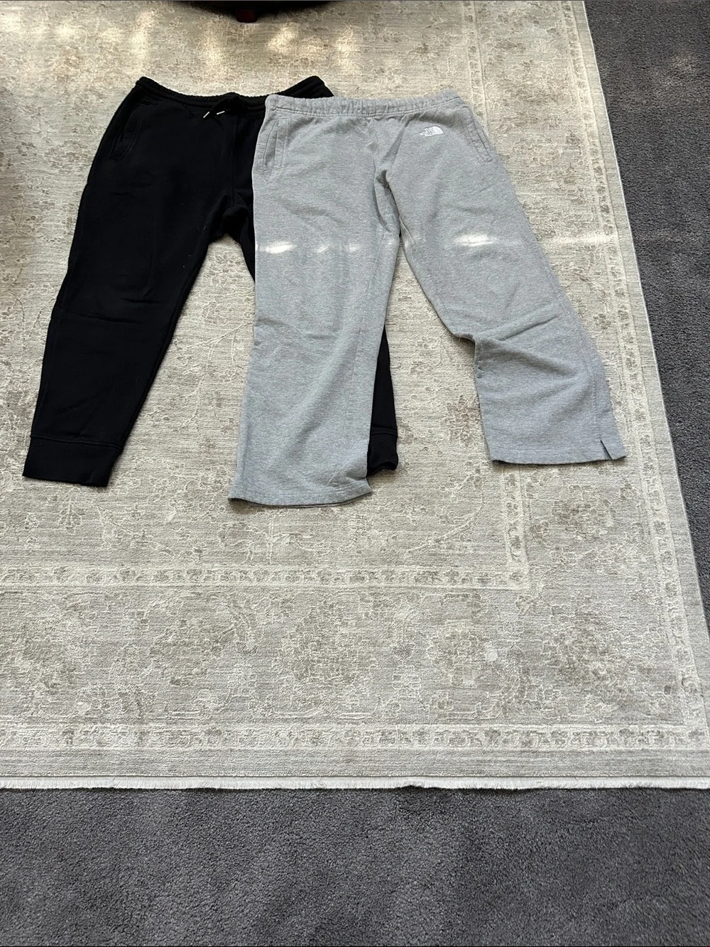 The North Face Men’s Large duo of one gray sweatpants and one black jogger.